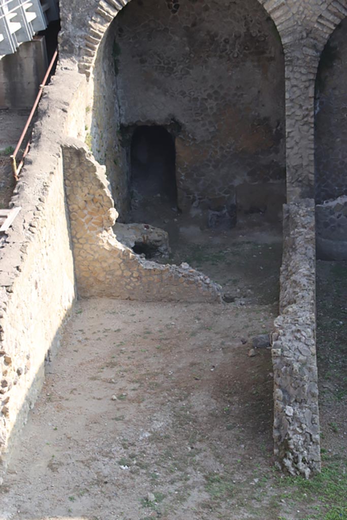 III.1/2/18/19, Herculaneum, October 2023. 
Looking north from access roadway towards area of rooms G, H, I, L, M, on west side of lower floor.
Photo courtesy of Klaus Heese.
