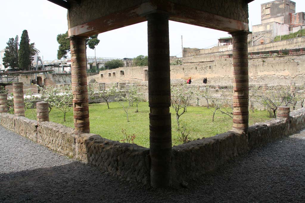 III. 1/2/18/19, Herculaneum. May 2006. Area 31, looking south from west side of large sunken peristyle of III, 1/2/18/19. 
Note - the access bridge to the site used to lead onto the southern rooms and peristyle.

