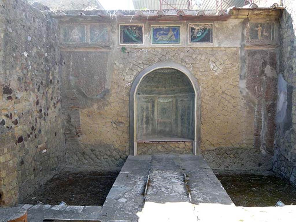 III.3 Herculaneum. August 2013. Looking towards east wall with nymphaeum, and mosaic covered frieze above. Photo courtesy of Buzz Ferebee.

