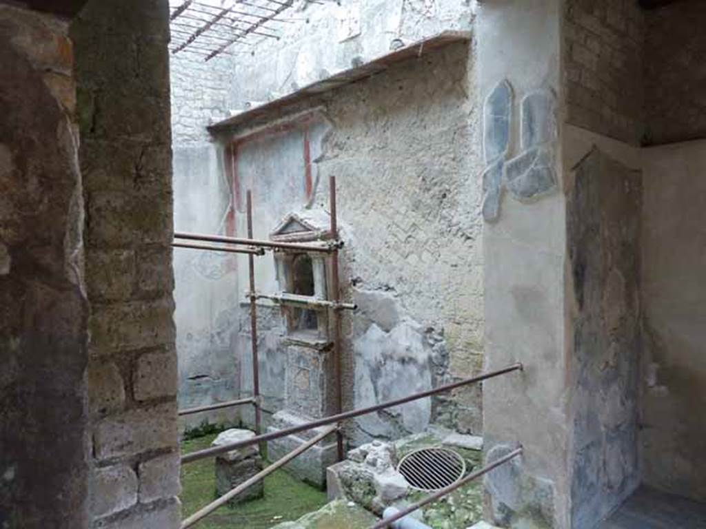 III.3 Herculaneum. May 2010. Looking east from small room towards the small internal courtyard or light-well. This area was protected by a grating above.



