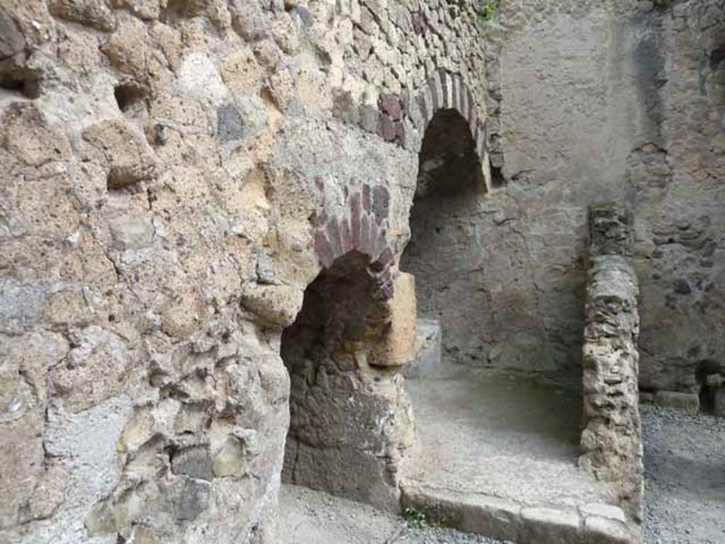 III.4 Herculaneum. May 2010. Looking east from doorway, two recesses under steps at III.5.