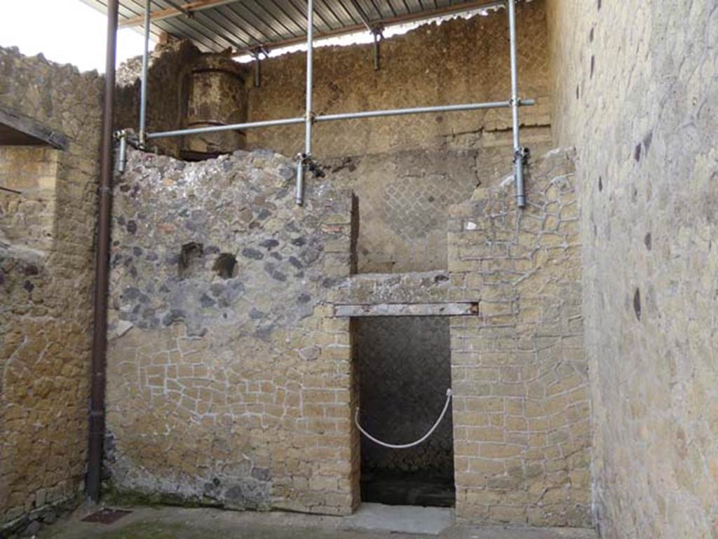 III.9 Herculaneum, October 2014. East wall with doorway into latrine. Photo courtesy of Michael Binns.