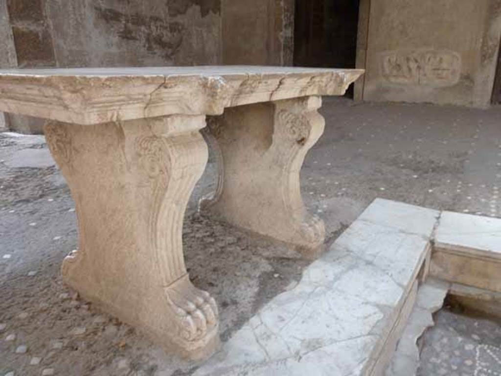 III.11 Herculaneum. May 2010. Room 6, detail of legs of marble table.