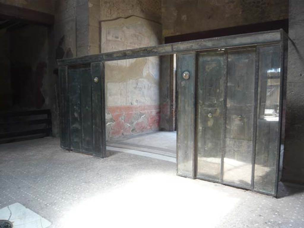 III.11 Herculaneum. August 2013. Room 6, looking south-west across atrium towards the wooden screen/partition into the tablinum. Photo courtesy of Buzz Ferebee.
