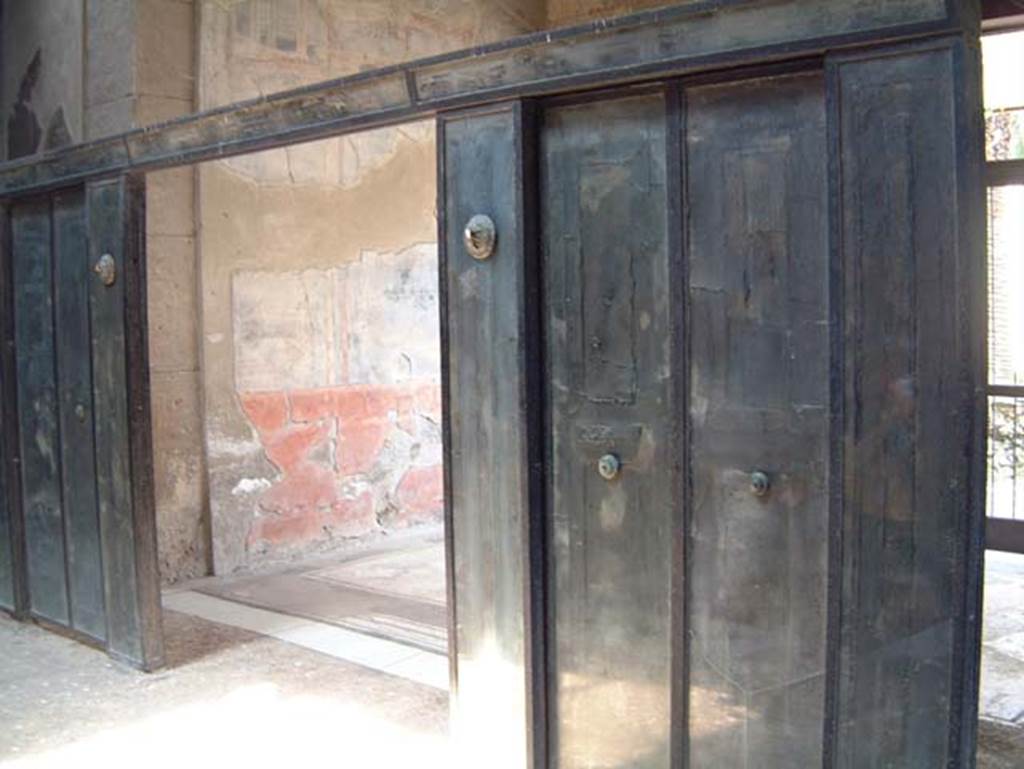 III.11 Herculaneum, May 2001. Room 6, wooden screen in atrium. Photo courtesy of Current Archaeology.
