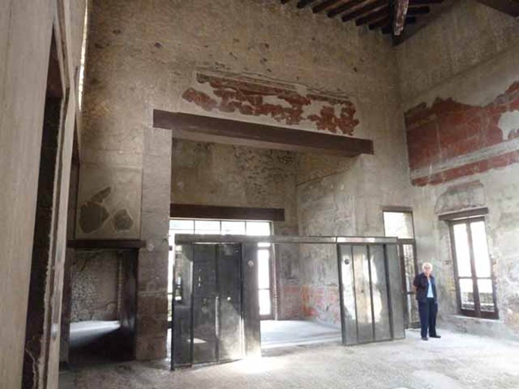 III.11 Herculaneum. May 2010. Room 6, looking west across atrium towards doorway to room 8, on left, tablinum 9, in centre, and corridor 10, on right. Taken from south-east corner of atrium near doorway to room 4.

