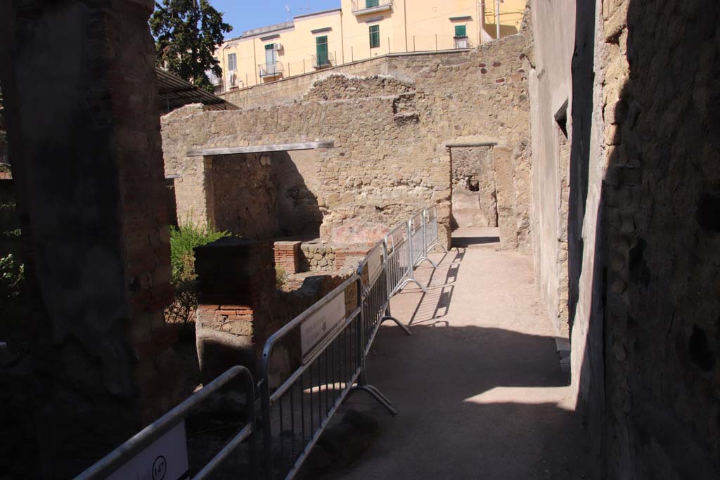 III.11 Herculaneum. September 2019. 
Looking west across north portico past rooms 12 and 13 towards doorways to room 16 and 17. Photo courtesy of Klaus Heese.

