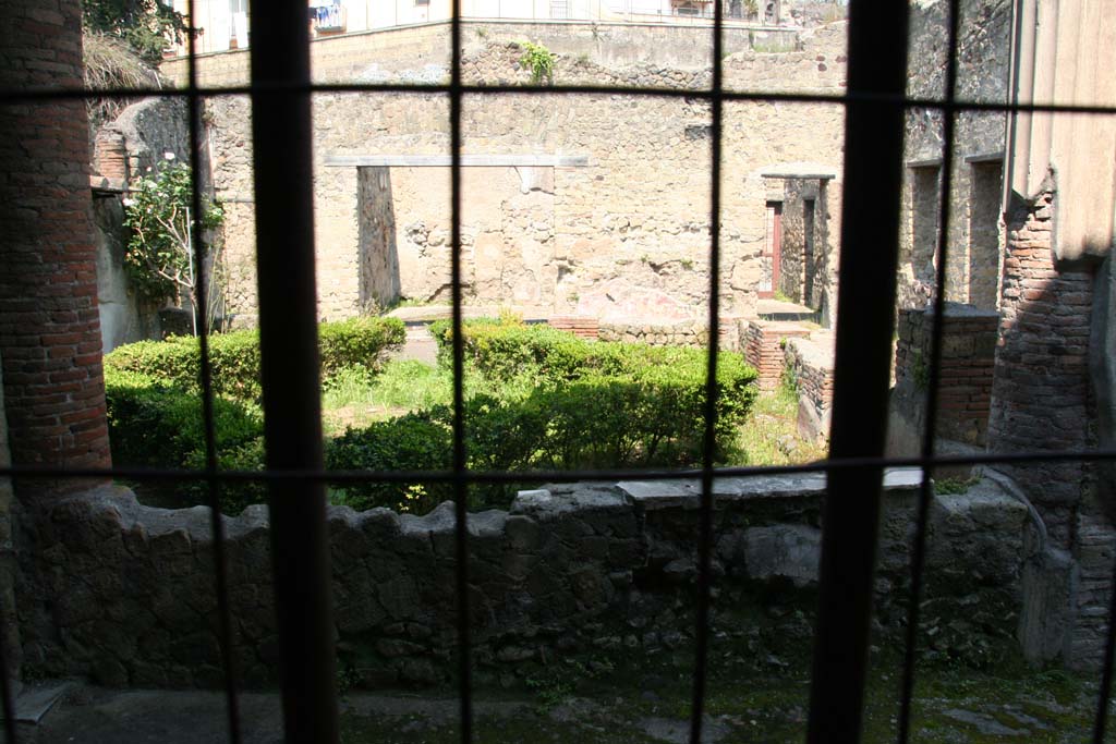 III.11 Herculaneum. April 2011. Room 9, west wall with opening to portico and garden peristyle area. Photo courtesy of Klaus Heese.