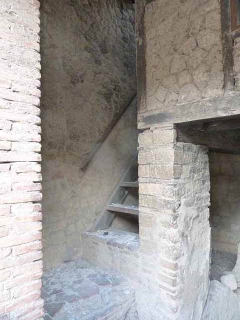 Ins. III. 12, Herculaneum. May 2010. Steps to upper floor at south end.