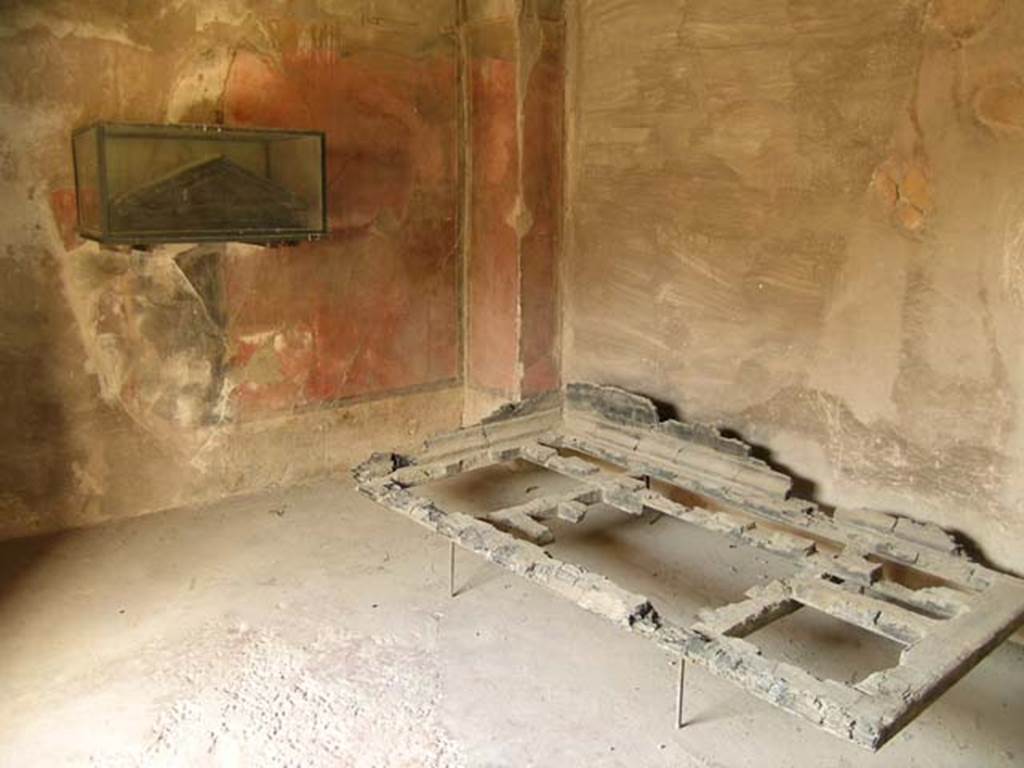 III. 13, Herculaneum. June 2005. 
Cubiculum 5, looking towards south-west corner of cubiculum, with the carbonised wooden bed. 
Photo courtesy of Nicolas Monteix.
