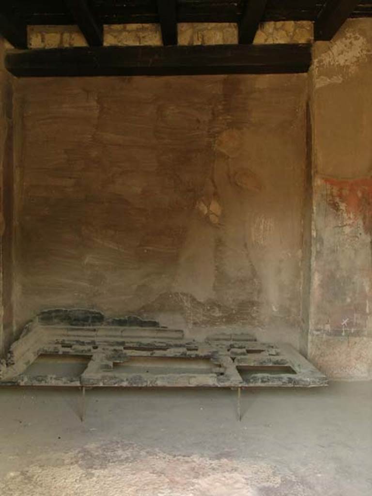 III.13, Herculaneum. April 2005. Looking towards west wall and carbonised wooden bed. Photo courtesy of Nicolas Monteix.
