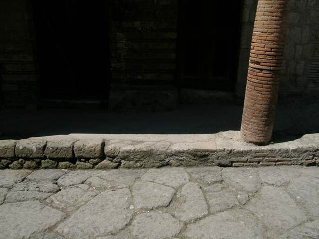 III.15/14/13, Herculaneum. April 2005. 
Looking west towards masonry column at northern end of balcony, and doorways at III.14 and III.13. 
Photo courtesy of Nicolas Monteix.
