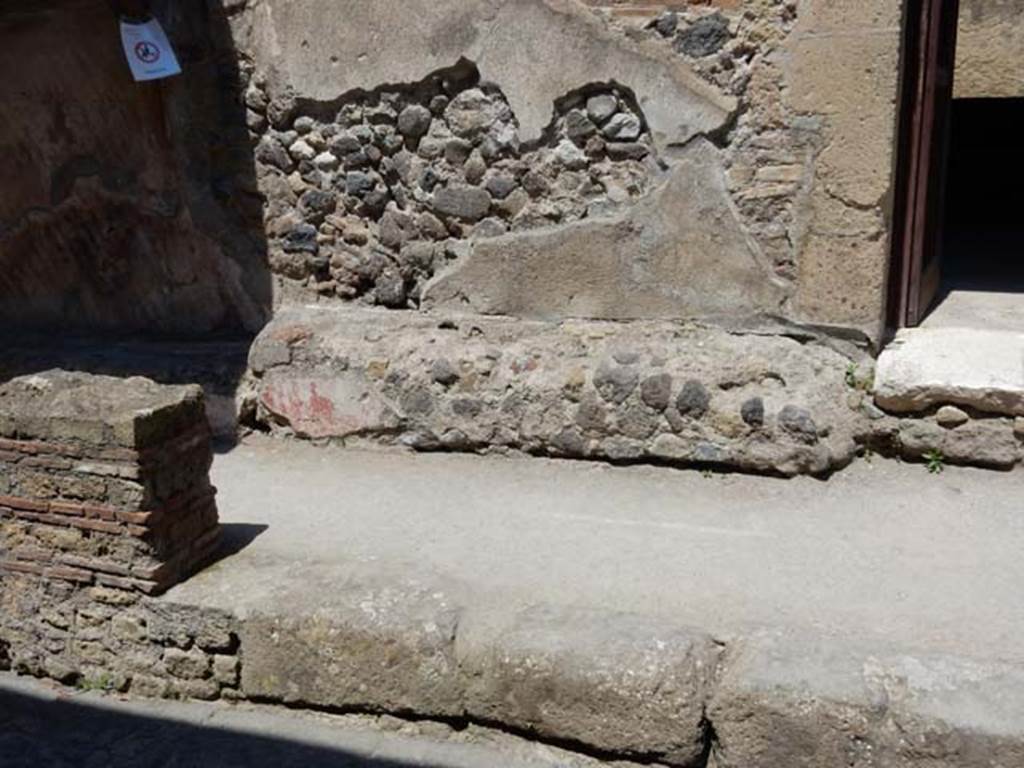 III.16, Herculaneum, May 2018. Bench on south side of entrance doorway. Photo courtesy of Buzz Ferebee