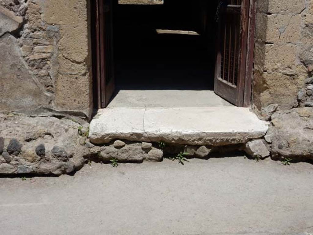 III.16, Herculaneum, May 2018. Threshold to entrance doorway. Photo courtesy of Buzz Ferebee