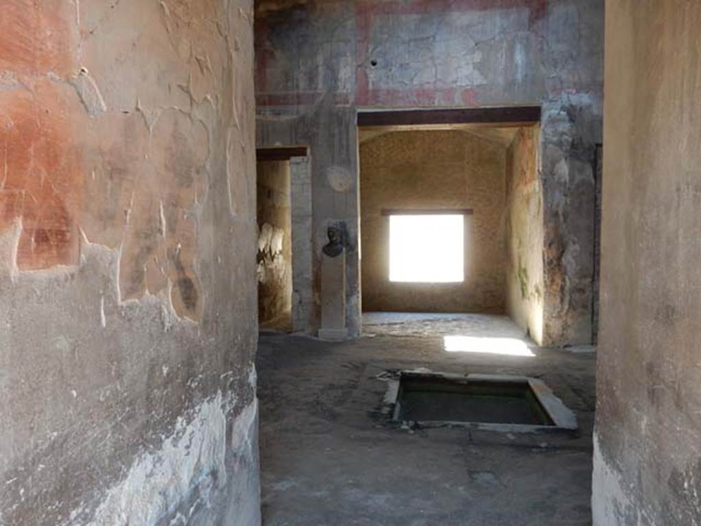 III.16, Herculaneum, May 2018. Looking west across atrium from entrance corridor. 
Photo courtesy of Buzz Ferebee


