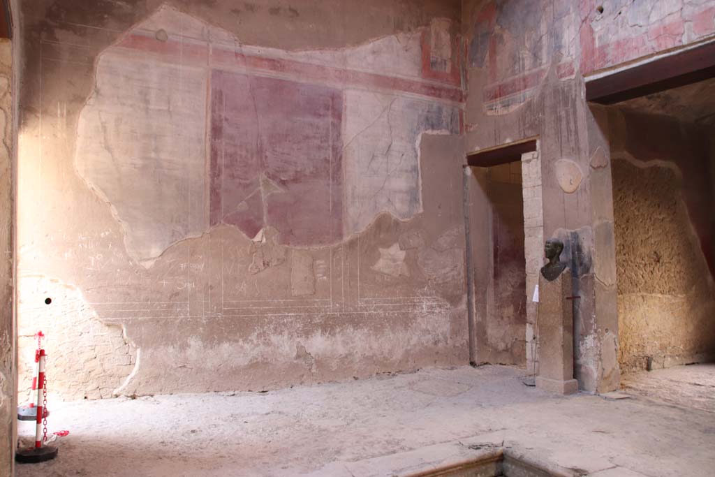 III.16, Herculaneum, September 2019. Room 9, south wall of atrium, with room 2 on left, and corridor 6, on right.
Photo courtesy of Klaus Heese. 
