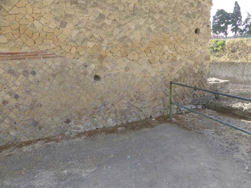 IV.2/1, Herculaneum, October 2014. Looking east across Cardo IV at its southern end, towards side wall of IV.2/1.  Photo courtesy of Michael Binns.
