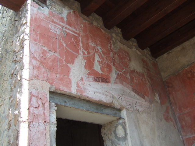 IV.4 Herculaneum. May 2006. Courtyard 3, upper west wall.