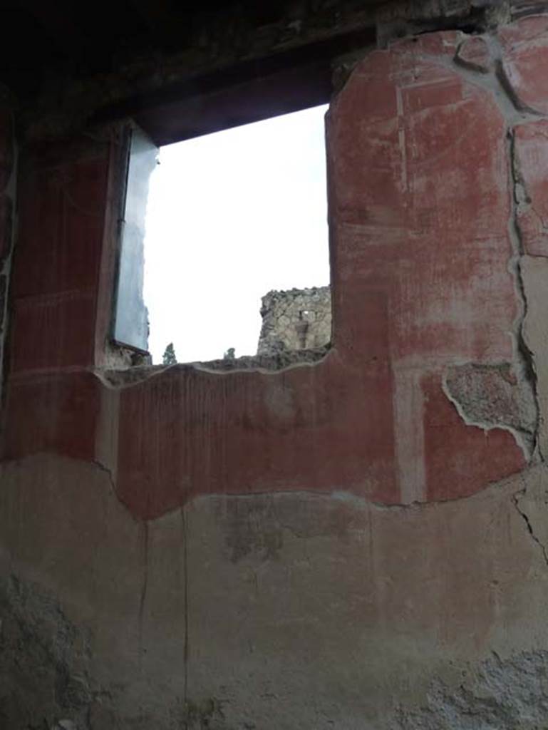 IV.4 Herculaneum. September 2015. Courtyard 3, detail of protection on north side of window in east wall. 