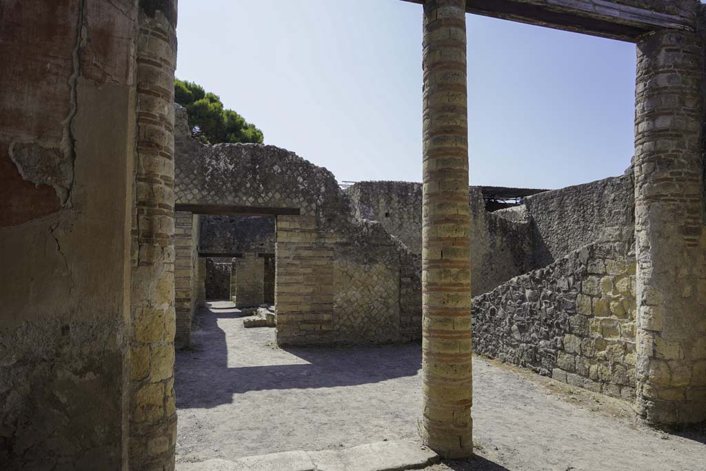 IV.4 Herculaneum. September 2015. Courtyard 3, east wall, looking south-east across open courtyard 6. 
