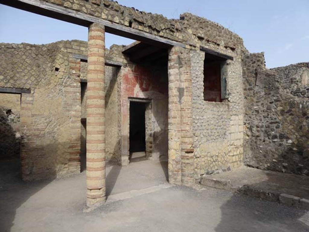 IV.4 Herculaneum. September 2015. Open courtyard 6, looking towards west wall with window from courtyard 3, and north-west corner. 
