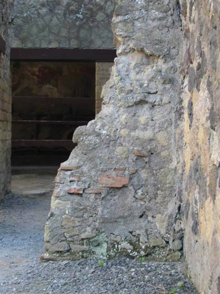 IV.11, Herculaneum, May 2003. 
Looking towards exterior wall of small cubiculum, on south side of Decumanus Inferiore, on west side of entrance doorway, on left. 
Photo courtesy of Nicolas Monteix.
