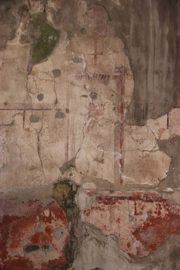 IV.11, Herculaneum, September 2021. 
Detail of painted decoration from north end of east wall of triclinium/oecus. Photo courtesy of Klaus Heese.



