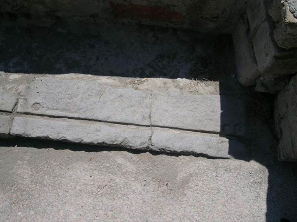 Decumanus Inferiore, Herculaneum. September 2015. South side of roadway, with IV.15 on corner, and exteriore façade of IV.13, on right.  Photo courtesy of Michael Binns.
