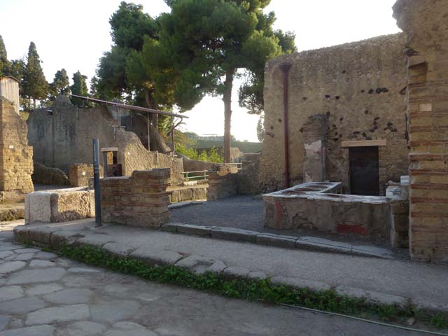 IV.15 Herculaneum, in centre, August 2021. Looking north from rear of bar-counter towards entrance on Decumanus Inferiore.
IV.16, entrance doorway to same bar-room is on the right, with doorway onto Cardo V.  Photo courtesy of Robert Hanson.
