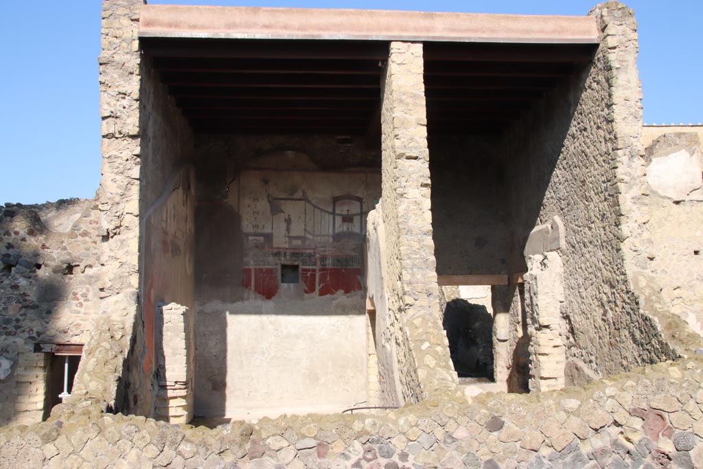 IV.15/16, Herculaneum. October 2022. 
Looking west towards room 9, on left, and room 8, on right, from Cardo V. Photo courtesy of Klaus Heese.
