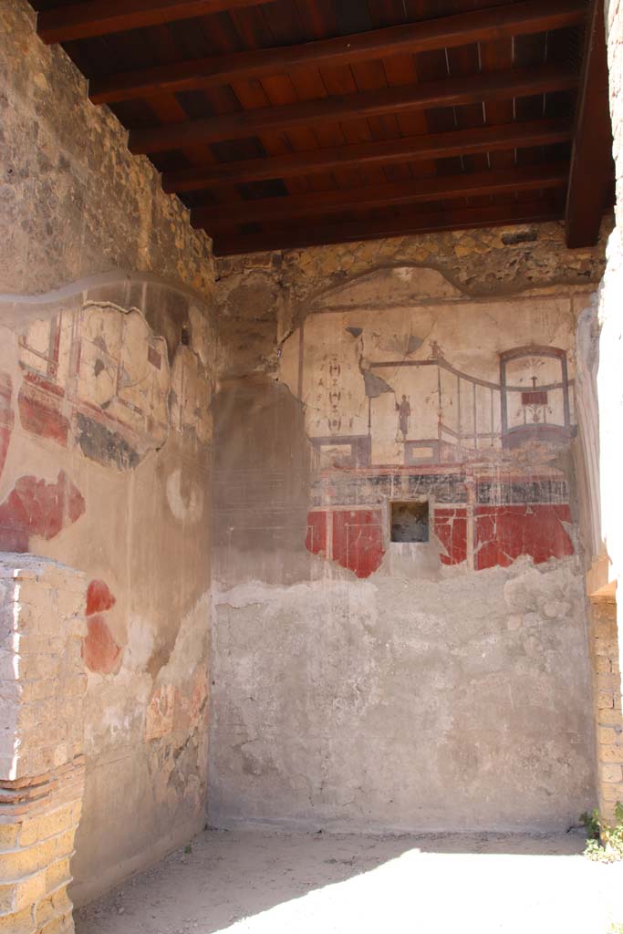 IV.15/16, Herculaneum, September 2019. 
Looking west to painted decoration on upper south and west walls of room 9.
Photo courtesy of Klaus Heese. 
