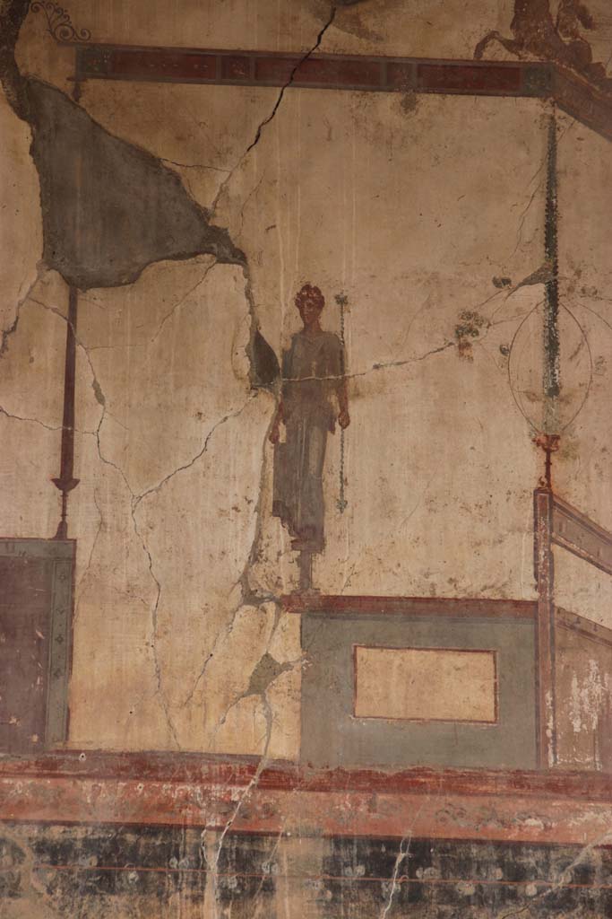 IV.15/16, Herculaneum, September 2017. Detail of painted figure of upper south end of west wall of room 9.
Photo courtesy of Klaus Heese.
