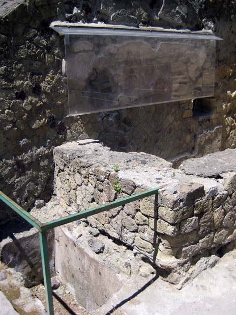 IV.17, Herculaneum, June 2011. Looking towards sales counter and painting on south wall. Photo courtesy of Sera Baker.
