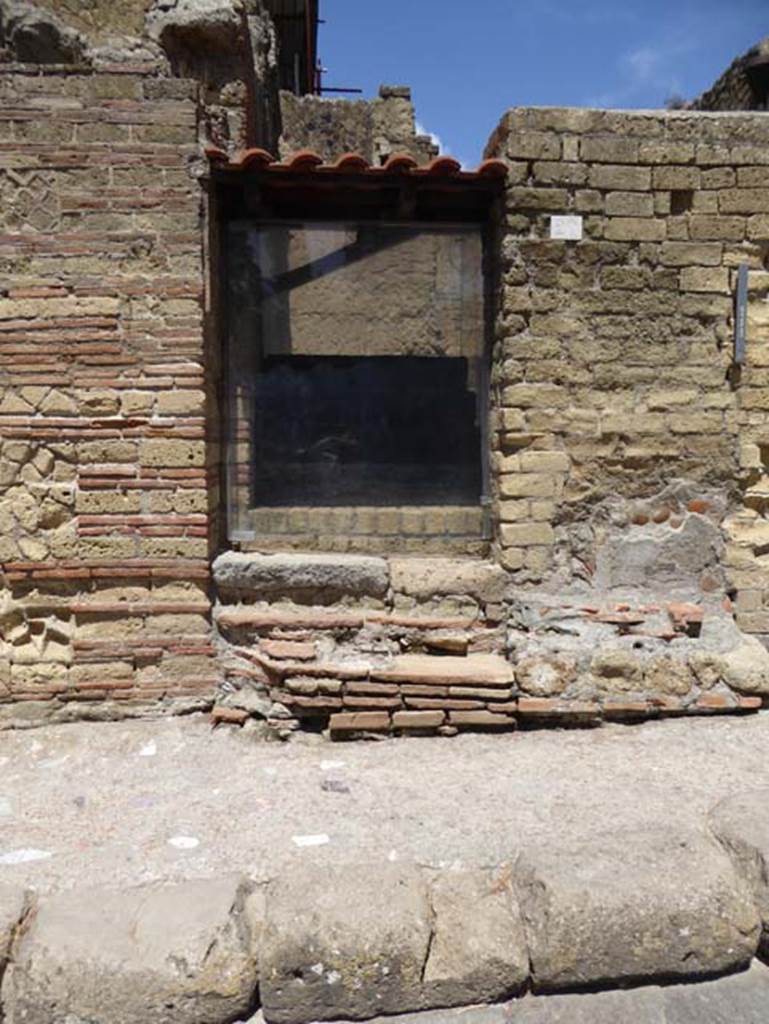 IV.20 Herculaneum, September 2015. Looking west to entrance doorway to steps of carbonised wood, protected by glass.  Photo courtesy of Michael Binns.
