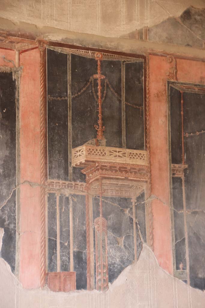 IV.21, Herculaneum, September 2019.  
Room 5, detail of painted decoration towards north end of west wall in triclinium. 
Photo courtesy of Klaus Heese.
