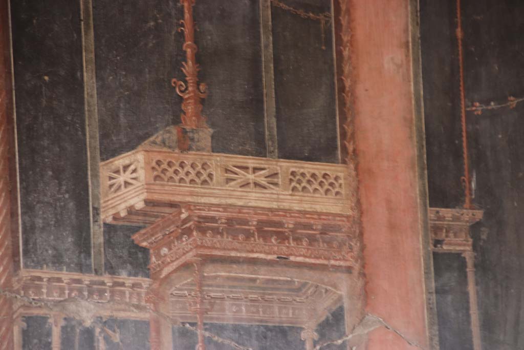 IV.21, Herculaneum, October 2020.   
Room 5, detail of painted decoration towards north end of west wall in triclinium. Photo courtesy of Klaus Heese.
