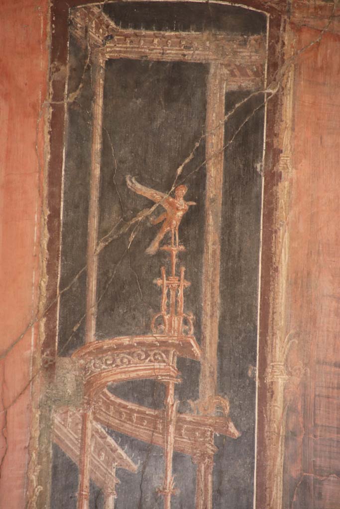 IV.21, Herculaneum. September 2019. 
Room 5, detail of painted decoration from west end of north wall. Photo courtesy of Klaus Heese.  
