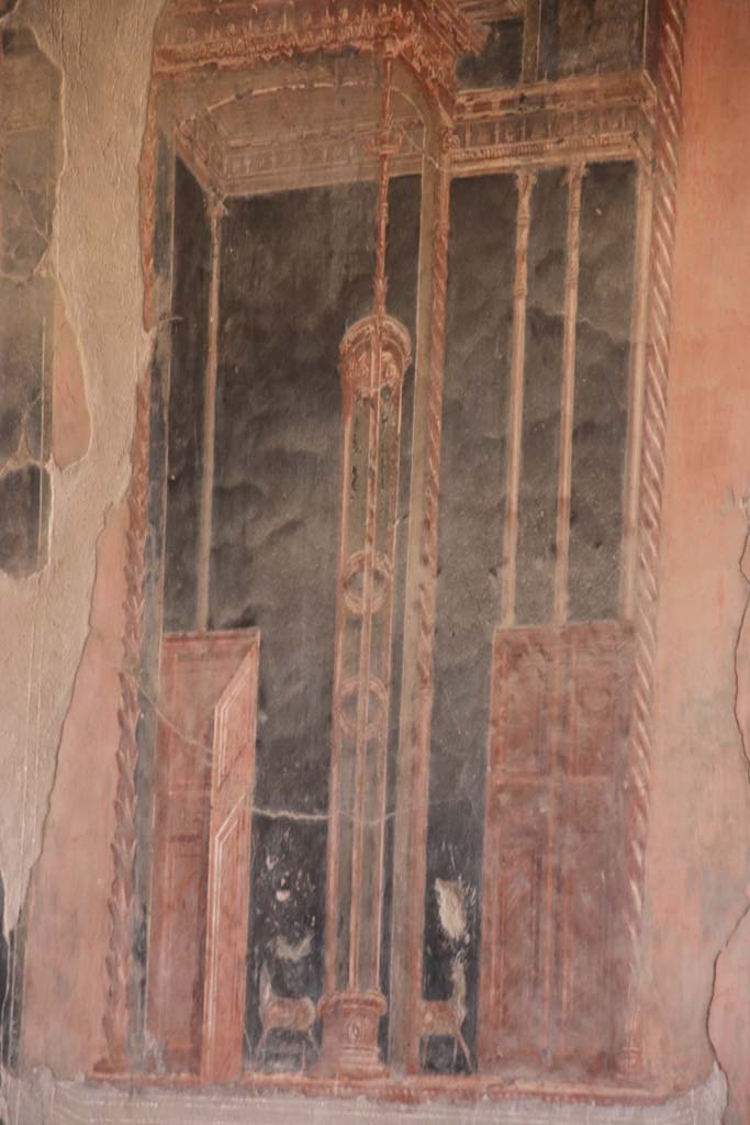 IV.21, Herculaneum. September 2019. Triclinium 5, detail of painted decoration at north end of east wall.
Photo courtesy of Klaus Heese.
