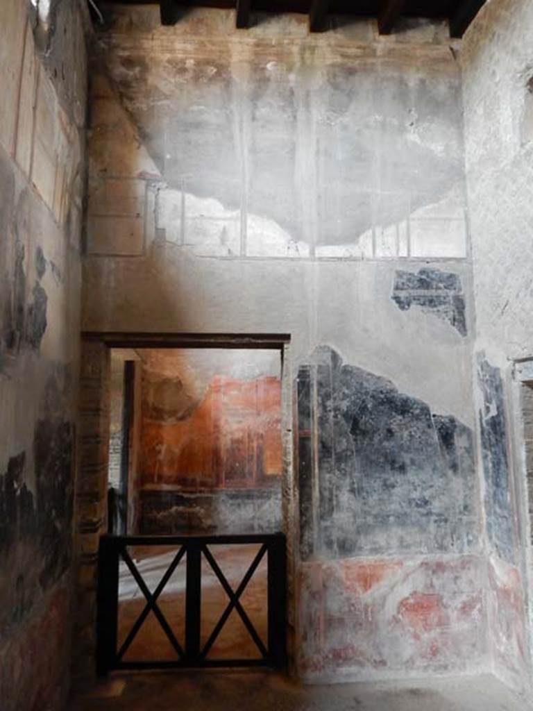 IV.21, Herculaneum. May 2018. Room 6, antechamber, looking west to doorway to oecus 7.
The doorway to Room 8 is in the north wall, on the right. Photo courtesy of Buzz Ferebee. 
