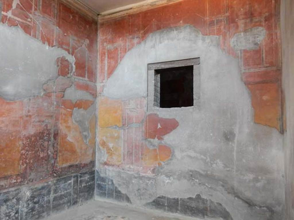 IV.21, Herculaneum. May 2018. Room 7, looking towards north-west corner and north wall with window into Cubiculum 10.
Photo courtesy of Buzz Ferebee. 
