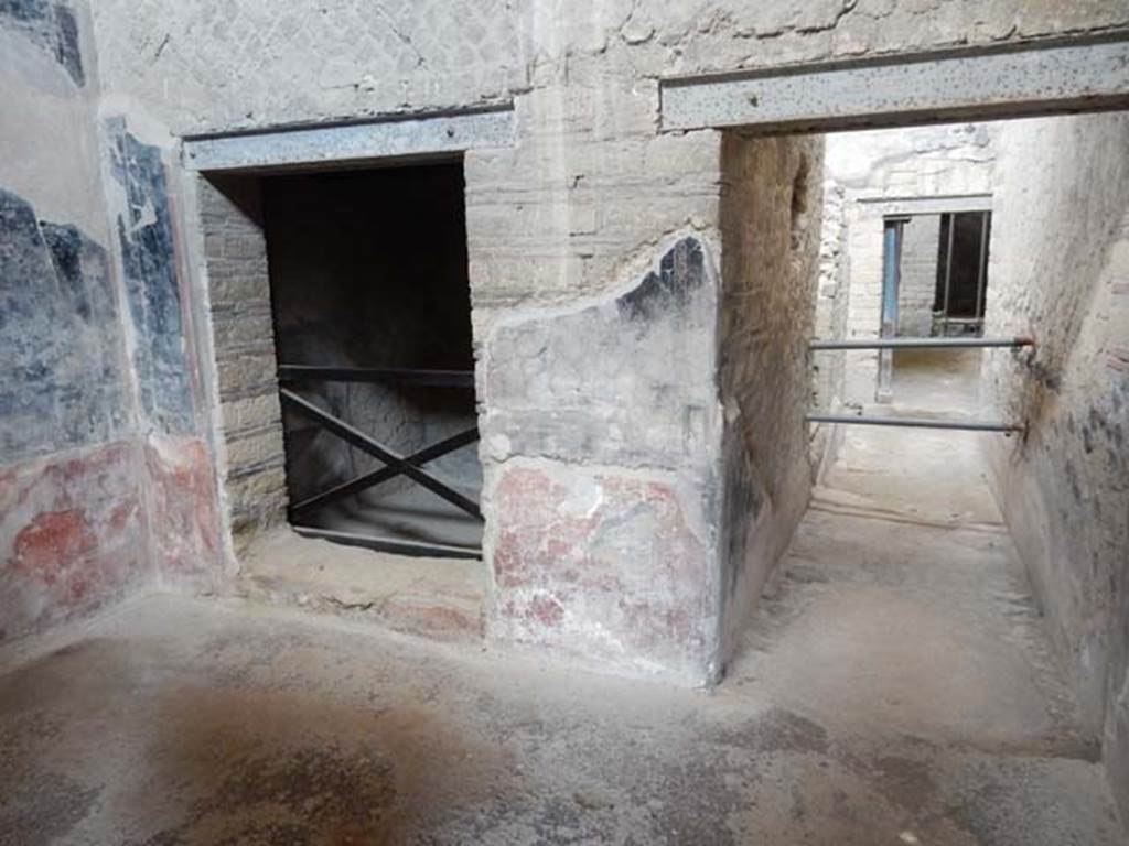 IV.21, Herculaneum. May 2018. Room 6, antechamber, looking towards north wall.
Doorway to room 8 is on the left, with Corridor 27, on the right. Photo courtesy of Buzz Ferebee. 
