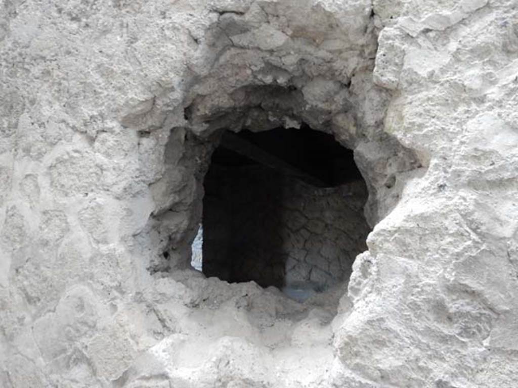 IV.21, Herculaneum. May 2018. Corridor 27, detail from west wall of hole looking into Room 8. Photo courtesy of Buzz Ferebee. 
