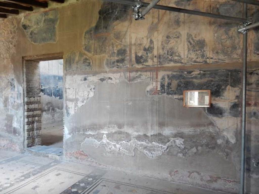 IV.21, Herculaneum. May 2018. Cryptoporticus 28, north wall at east end, with doorway to atrium, on left.
Photo courtesy of Buzz Ferebee. 
