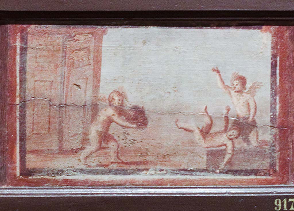 IV.21, Herculaneum. Small painting of 3 cupids, one with a mask. 
Now in Naples Archaeological Museum. Part of inventory number 9177.
