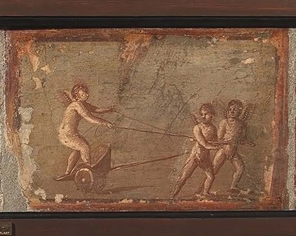 IV.21, Herculaneum. Cupid on a cart, being pulled by two others.
Now in Naples Archaeological Museum. Part of inventory number 9178.

