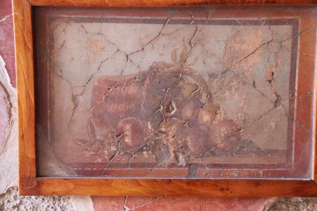 IV.21, Herculaneum, October 2020. 
Cryptoporticus 29, painted panel with still life of fallen basket of fruit, from west wall of east portico. Photo courtesy of Klaus Heese.
