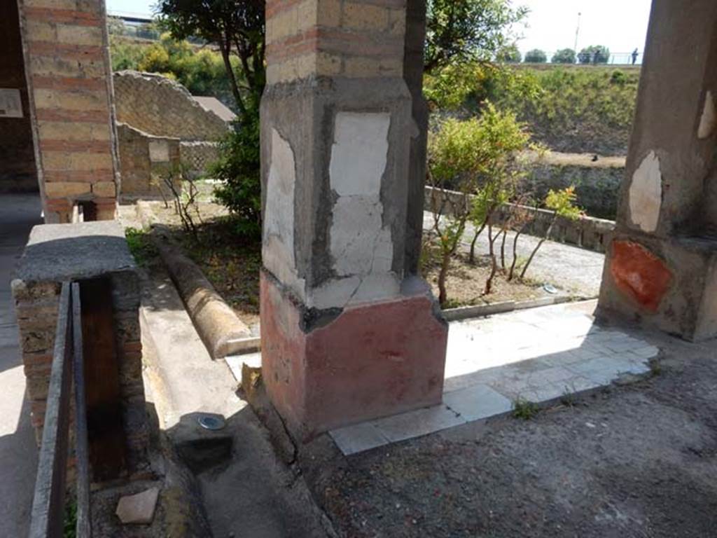 IV.21, Herculaneum. May 2018. Room 18, looking south-east towards garden terrace overlooking beachfront.
Photo courtesy of Buzz Ferebee. 
According to Jashemski – “Flanking the pergola (room 18) there were two small gardens. 
On the far side of each little garden there was an elegant room for repose with a window or door looking into the garden, another window looking out onto the sea.
The statuettes of the boy Eros may have decorated these rooms, and have been swept below by the torrent of mud that overwhelmed Herculaneum.”
See Jashemski, W. F., 1993. The Gardens of Pompeii, Volume II: Appendices. New York: Caratzas. (p.265)
(Note: copies of the statuette of the boy Eros now decorate the tomb of Nonius Balbus on the terrace of the Suburban Baths).

