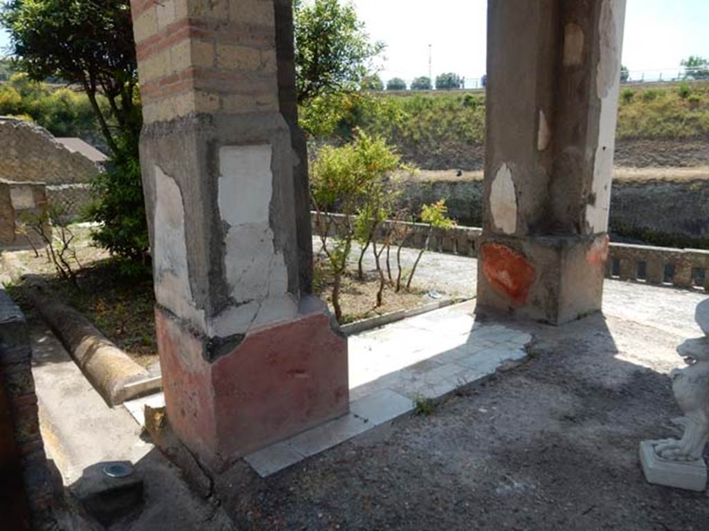 IV.21, Herculaneum. May 2018. 
Room 18, pilasters on east side, looking towards garden terrace with Room 22 at far end, on left.
Photo courtesy of Buzz Ferebee. 
