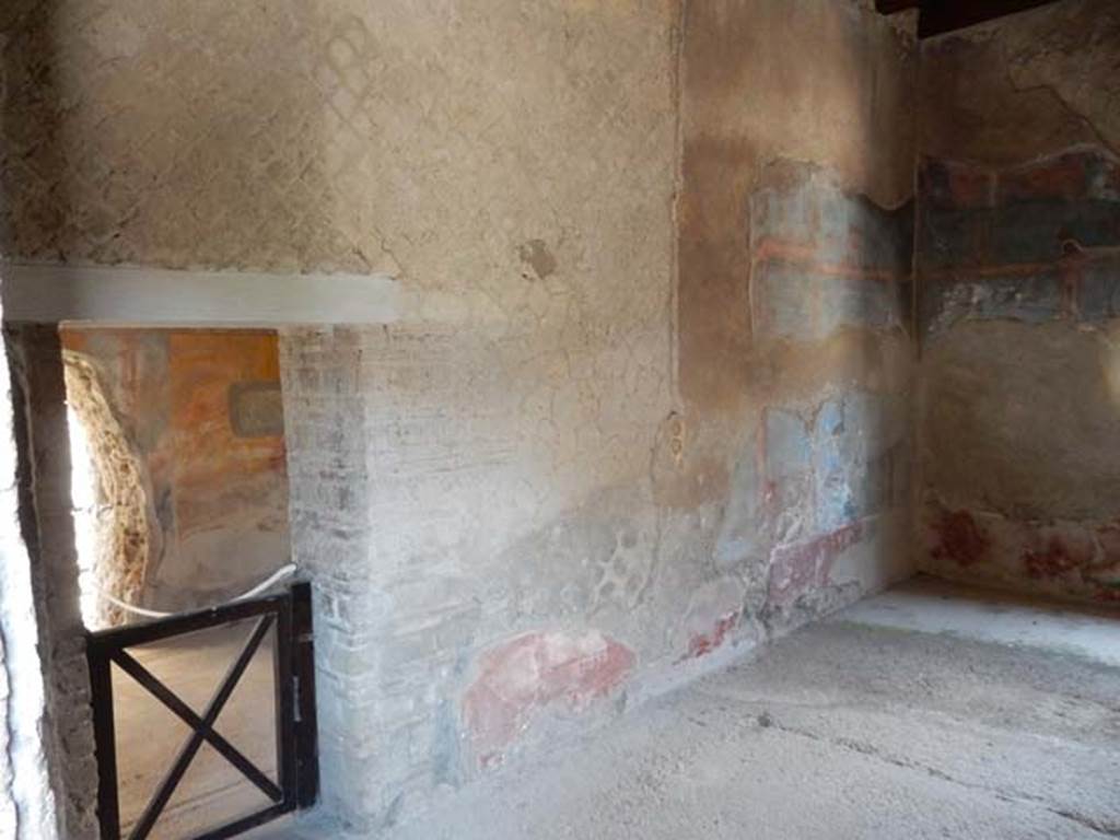 IV.21, Herculaneum. May 2018. Oecus 16, looking towards west wall with doorway onto Cryptoporticus 31.
Photo courtesy of Buzz Ferebee. 
