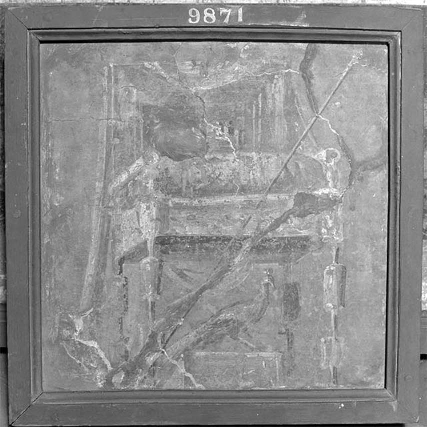 IV.21 Herculaneum. Oecus 16. Right side of the east wall. Throne with the attributes of Juno.
Now in Naples Archaeological Museum. Inventory number 9871.
According to Allroggen-Bedel, this shows on a blue-green ground a throne painted in light-dark technique with attributes of Juno. Two counterparts are in situ in room 16: above the right-side panel of the west wall a throne with Minerva Attributes, on the left of the east wall another, barely recognizable throne. This fragment in the Museo Nazionale was cut from the right side of the east wall; On the opposite west wall the wall is broken by a door.
See Allroggen-Bedel A., 1975. Der Hausherr der Casa dei Cervi in Herculaneum. Cronache Ercolanese 5, pp. 99-103. 

